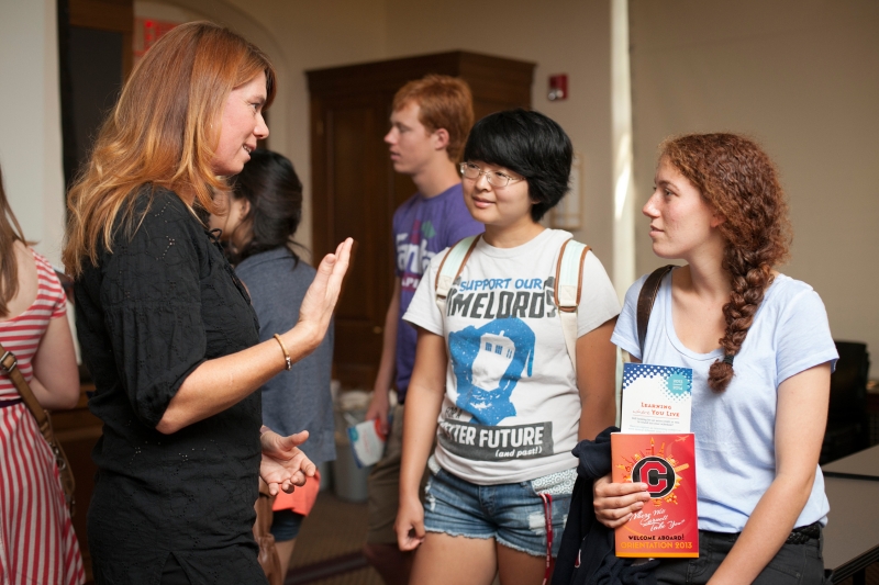 Sahara Byrne, assistant professor of communication (COMM), speaks with new students in the Takton Center during Orientation Week.